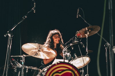 Young Woman Playing the Drums